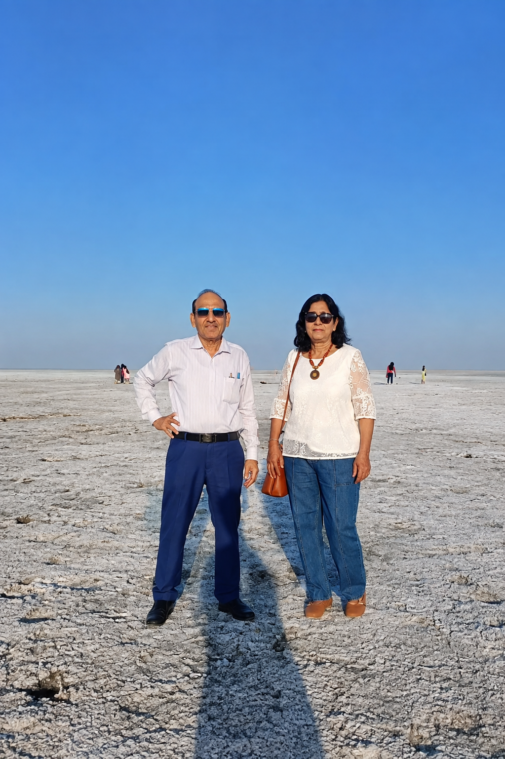 Elderly couple standing together on the White Rann salt desert, Kutch