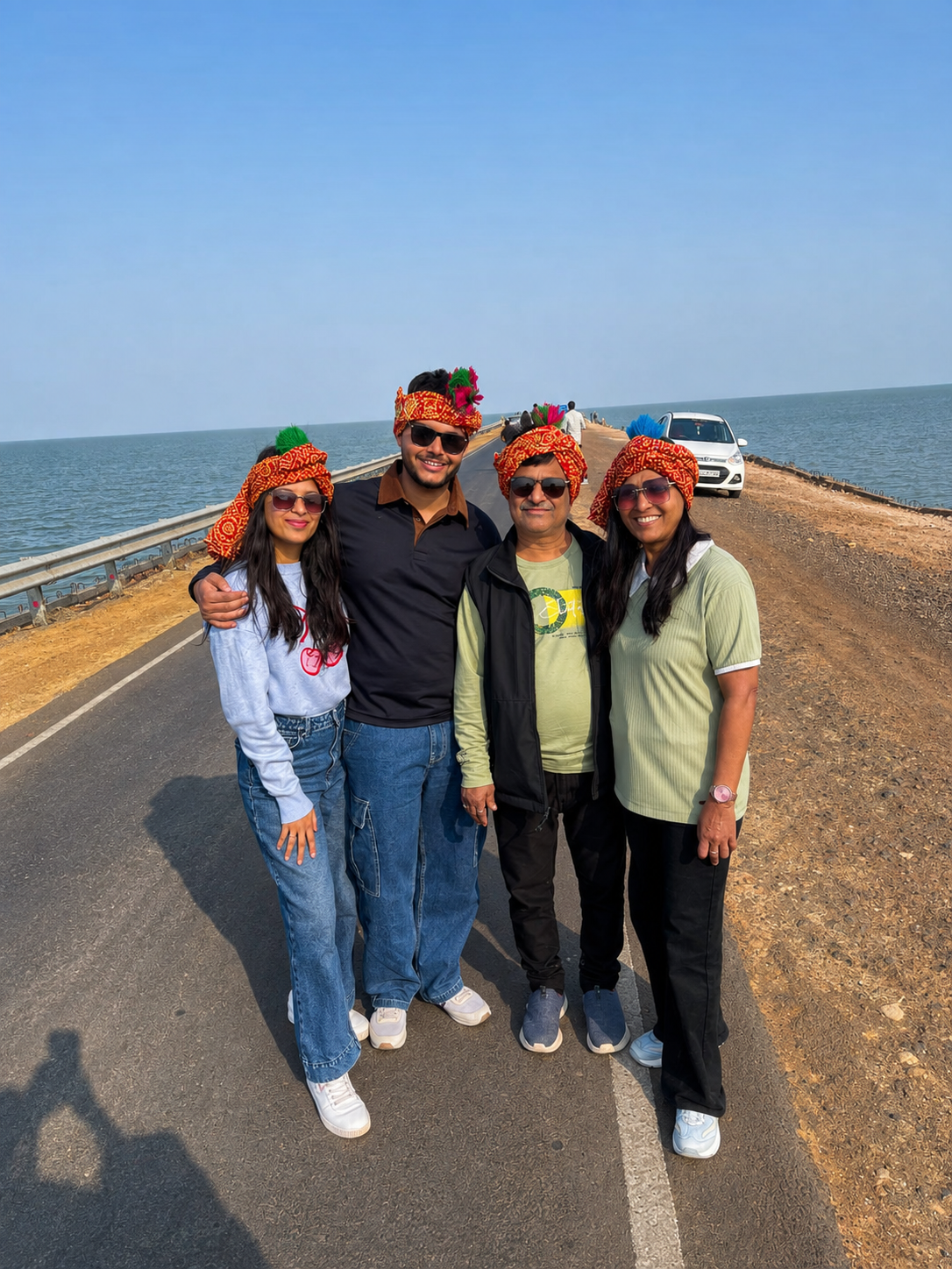 Family of four in traditional Kutchi turbans on the Road to Heaven bridge, Kutch